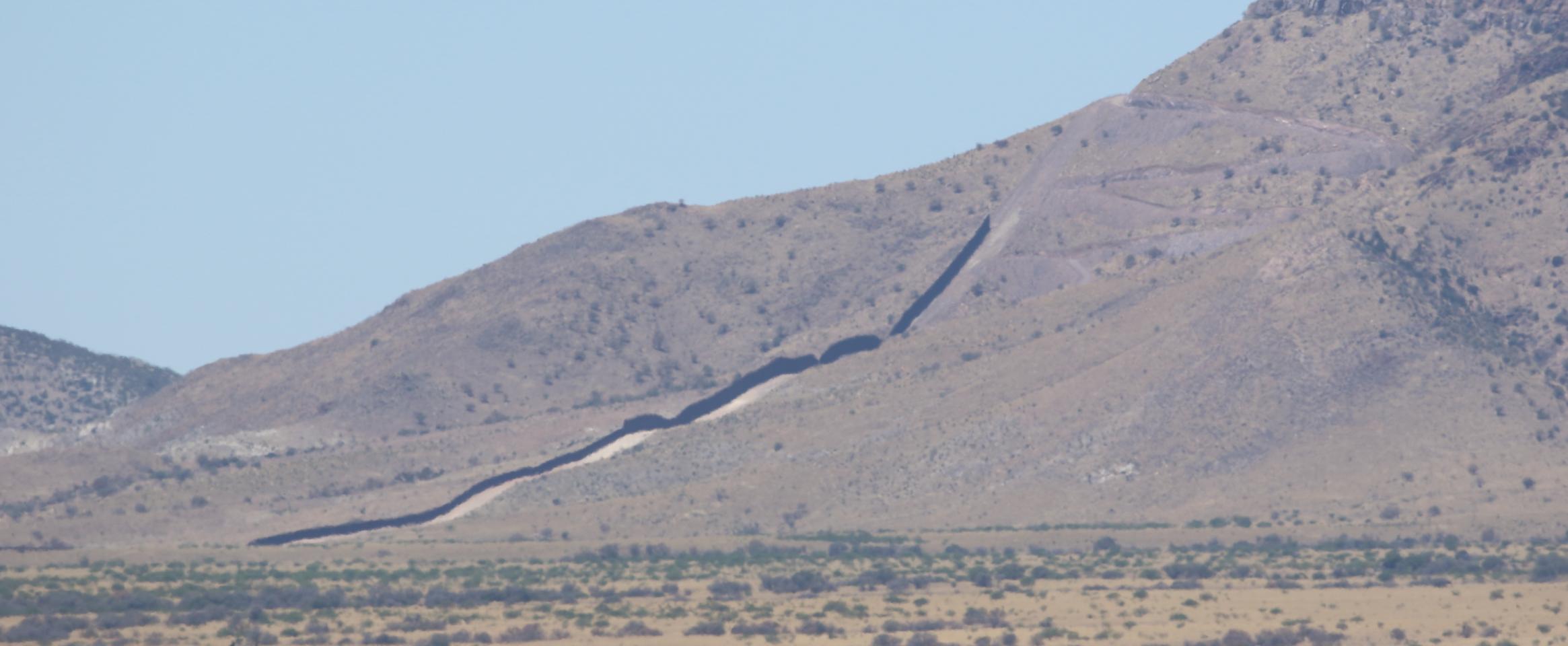 Rectangular photo showing one of the last sections of the border wall nearing completion at the time of the author’s visit in May 2022. 