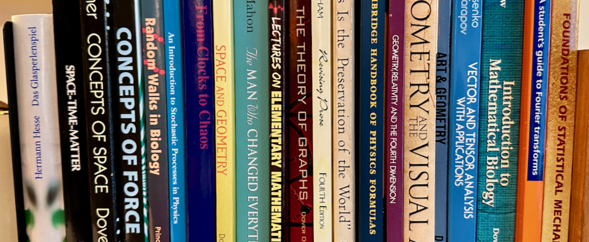 Rectangular photo of David Nolte’s office bookshelf showing works on physics, space, mathematics and geometry. Photo credit David Nolte