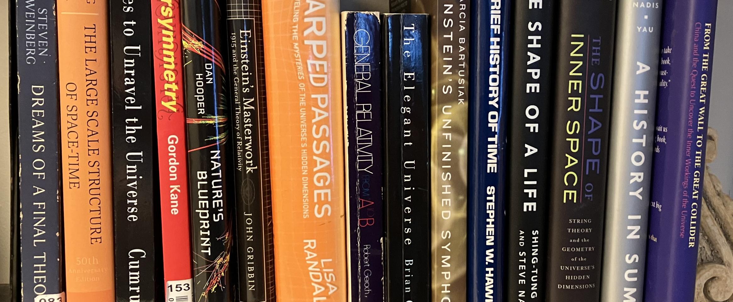Rectangular photo of Steve Nadis’ office bookshelf showing several works on Einstein, general relativity, and space-time, along with Nadis’ and his coauthor’s previous books on these topics. Photo credit: Steve Nadis.