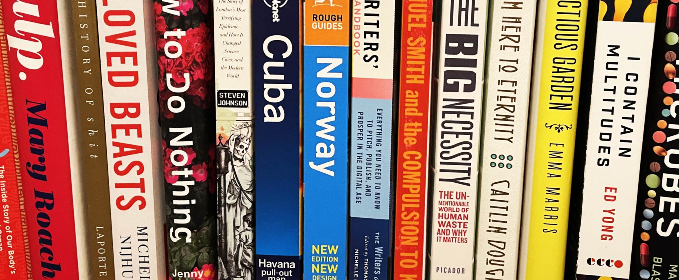 Photo of bookshelf in Bryn Nelson's office showing some of the reference books for his book, Flush.