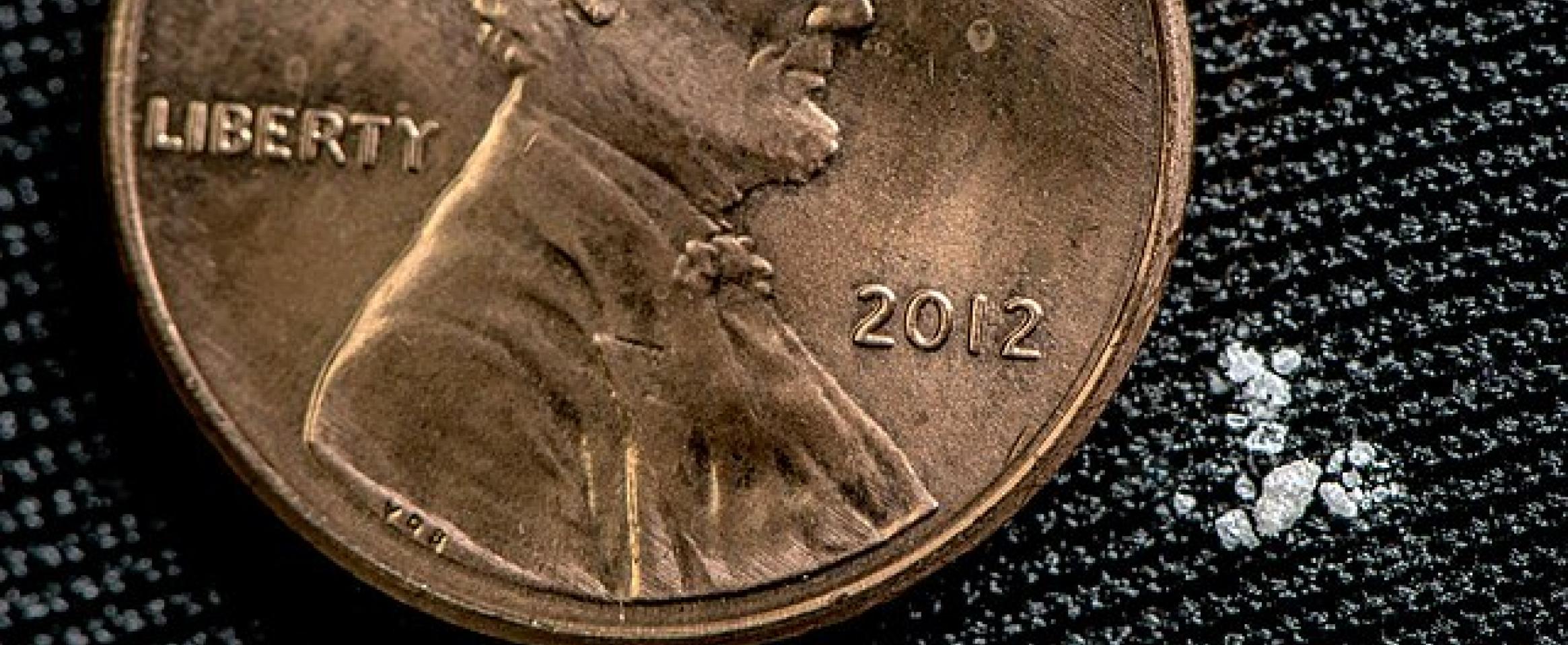 Two milligrams of fentanyl alongside a penny for scale. This dose is considered to be lethal for a 150-pound human, with this estimate extrapolated from data in monkeys. Credit: United States Drug Enforcement Administration (Creative Commons License).
