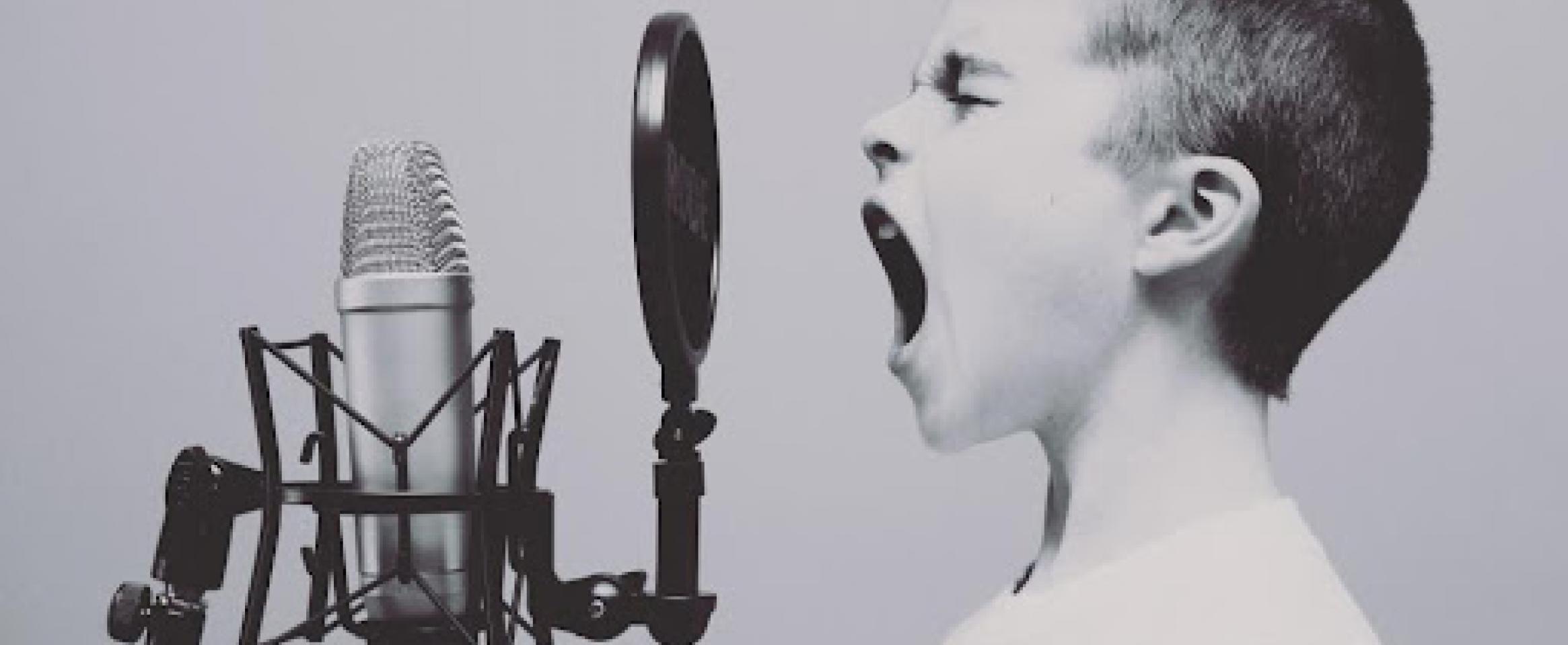 Child speaking into a microphone