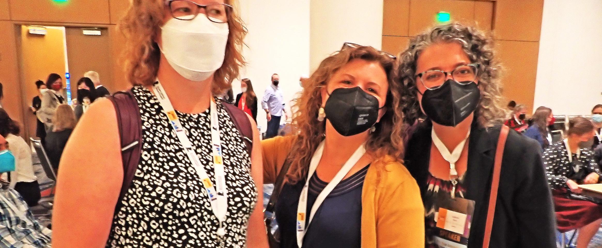Horizontal photo of N A S W members Kendall Powell, Jenny Cutraro, and Sarah Webb wearing masks and excited to participate as mentors at the Science Writers 2023 Annual Meeting. Photo by Ben Young Landis