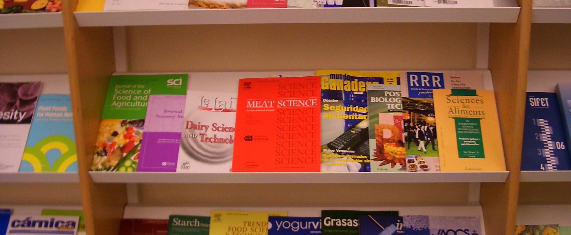 Science journals on bookshelf