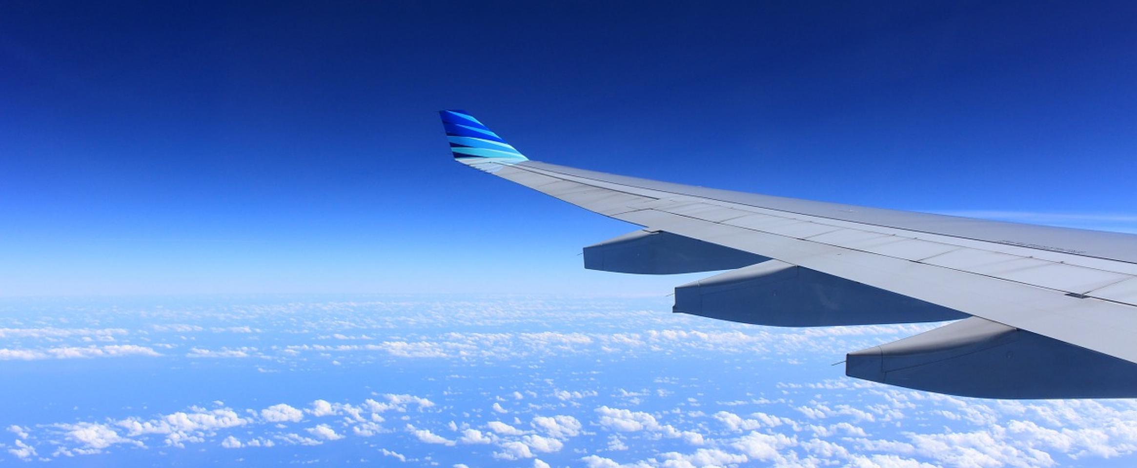 A photo of a airplane wing during a flight