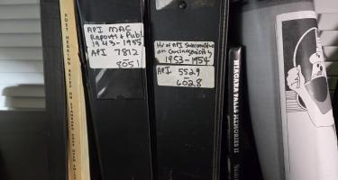 Rectangular photo of Jim Morris’ office bookshelf showing a small sample of the thousands of legal, medical, and other documents he used to write The Cancer Factory. Photo credit: Jim Morris.