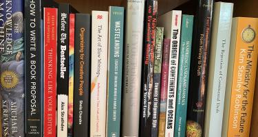 For bookshelf photo: Rectangular photo of Roberta Kwok’s office bookshelf showing works on continental drift, animal life, astronomy, uranium mines in Navajo lands, and other topics addressed in Kwok’s book, as well as books on writing and editing a book. 
