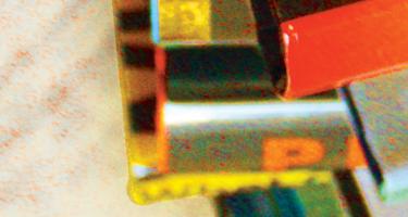 Inset photo from the cover art of the Summer Fall 2023 Science Writers magazine cover with stylized photo of books stacked.