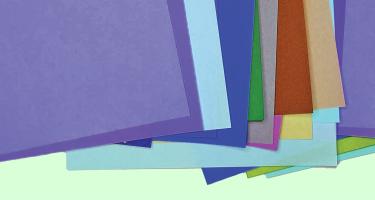 Illustration simulating origami paper overlapping in different colors.