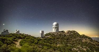 The Mayall Telescope and greater Kitt Peak Observatory as seen from a distance