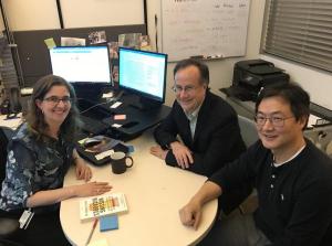 A photo of Rosa Krajmalnik-Brown, James Adams and Dae-Wook Kang sitting around a table.