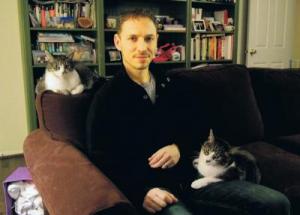 David Grimm, with Jasper on his lap, and Jezebel