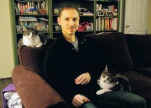 David Grimm, with Jasper on his lap, and Jezebel