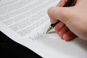 Hand signing contract