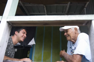 Emiliano Rodríguez Mega reporting on coral reef conservation in Belize