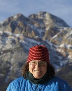 Portrait photo of Sarah Boon in front of a snow-covered peak