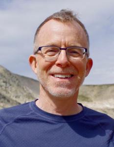 Portrait photo of David Baron in an outdoor setting.