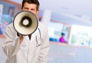 Doctor with bullhorn image via Shutterstock