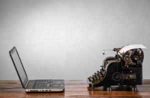Laptop and typewriter image via Shutterstock