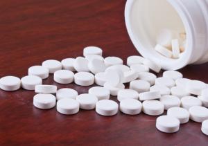 White pills image via Shutterstock
