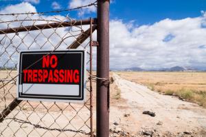No trespassing sign image via Shutterstock