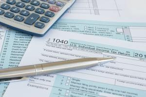 Income tax forms image via Shutterstock