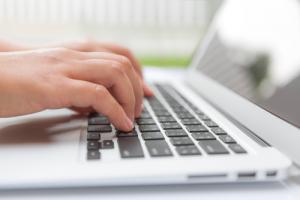 Typing on keyboard image via Shutterstock