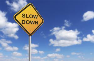 "Slow down" sign image via Shutterstock