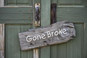 "Gone broke" sign image via Shutterstock