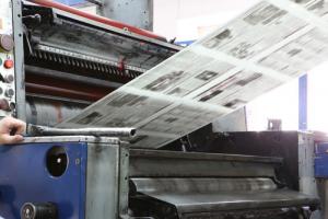 Printing press image via Shutterstock