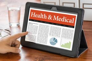 Medical news on tablet image via Shutterstock