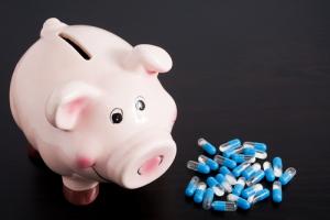Pills and piggybank image via Shutterstock