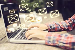 Sending email from laptop image via Shutterstock