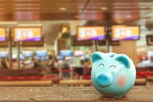 Smiling piggy bank image via Shutterstock