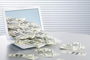 Computer and cash image via Shutterstock
