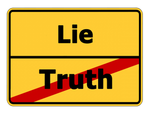 Sign reading "lie" and "truth"