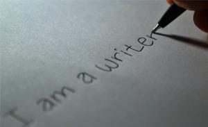Pen writing "I am a writer"