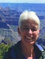 Portrait photo of Wynne Brown, with backdrop of the Grand Canyon