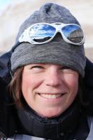 Portrait photo of Julia Rosen, wearing a toque and snow glasses atop her head